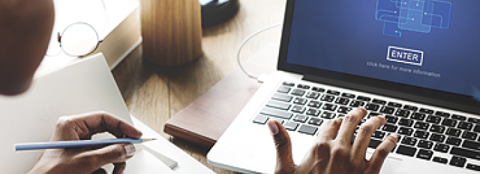 Man at laptop to join a webinar