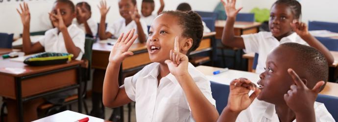 image shows children in a classroom