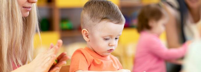 early years child playing with toy