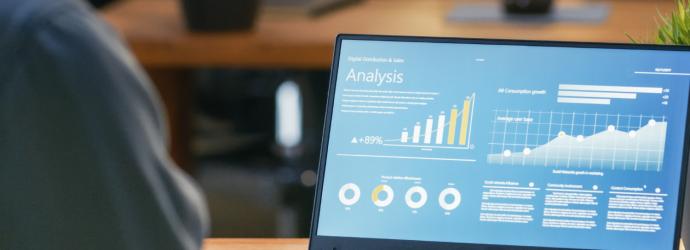 laptop screen showing charts
