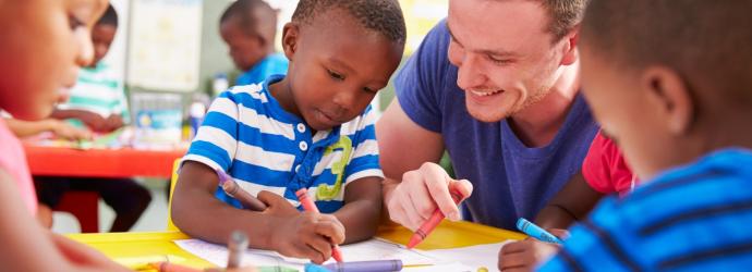 teacher with children drawing pictures