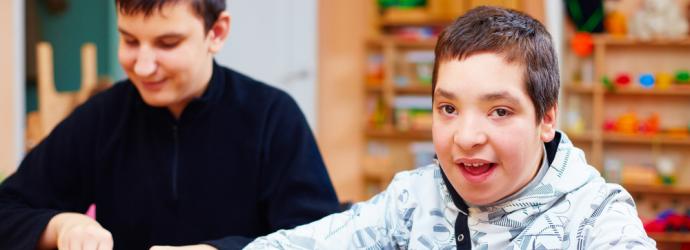 two teenage boys with SEND in a classroom