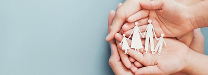 hands holding paper family