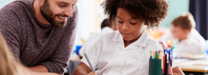 Teacher with primary student