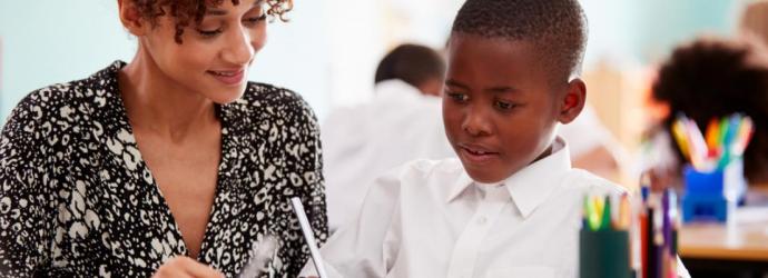 female teacher with young pupil