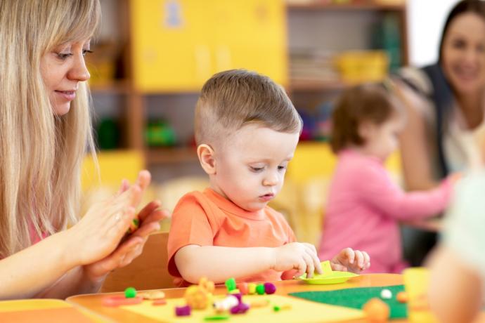 early years child playing with toy