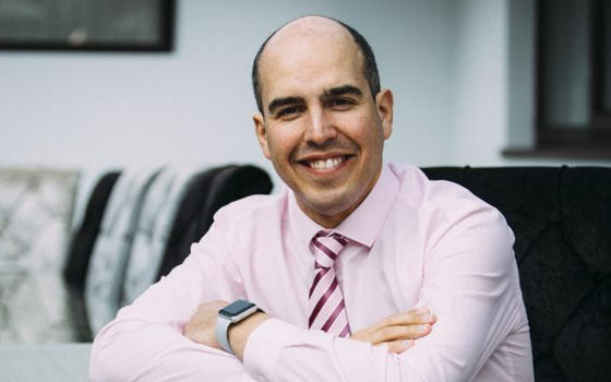 Head shot of Adam Boddison