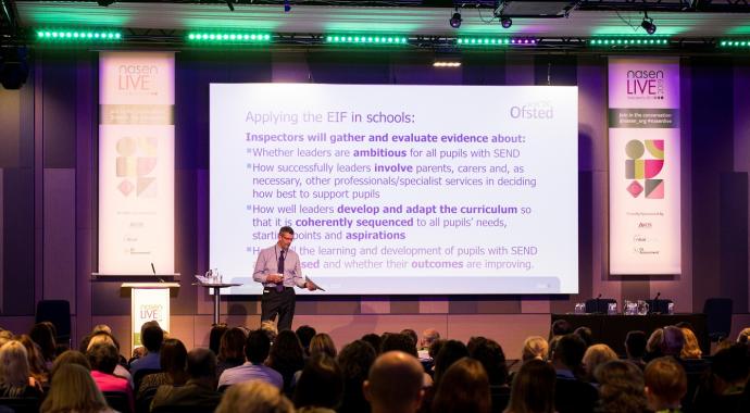 speaker in a large auditorium at nasen Live 2019