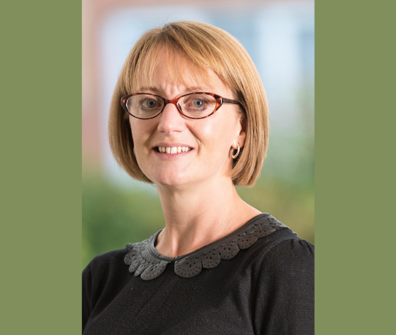 Professional headshot photograph of Alex Grady